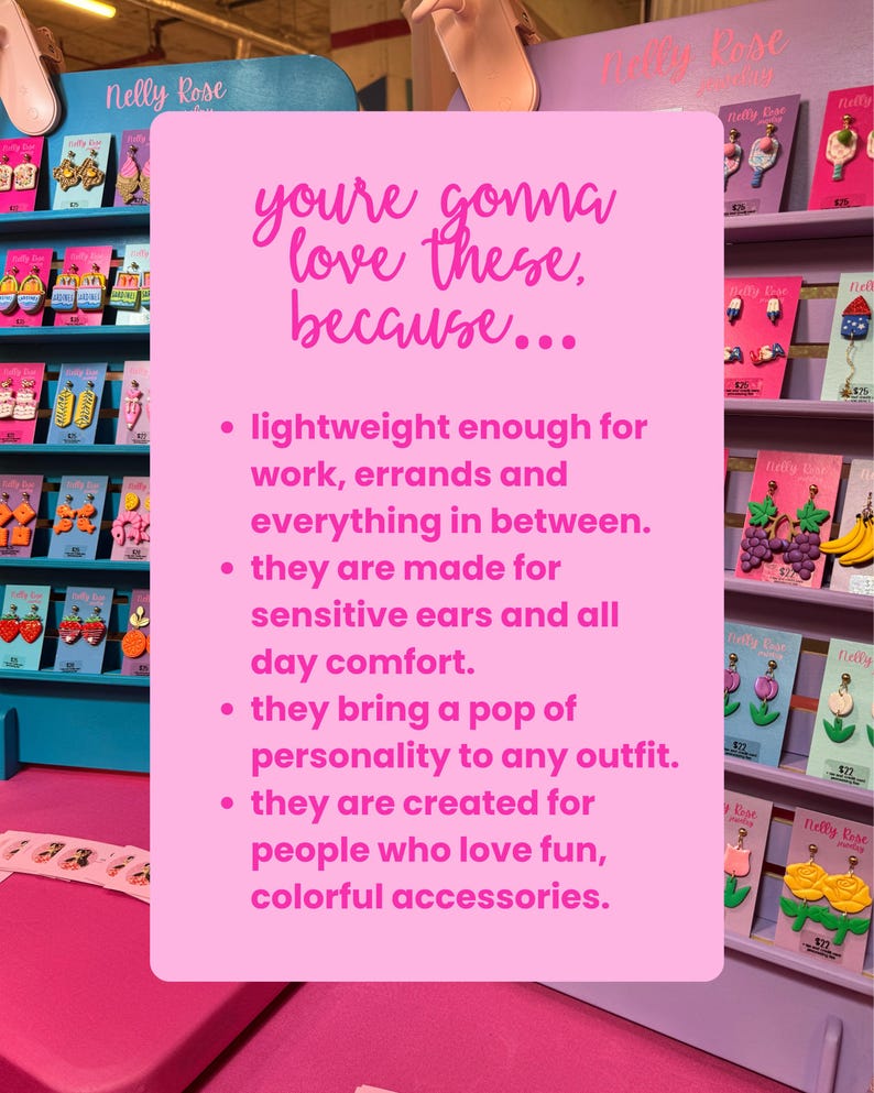 a display of colorful earrings and accessories, with a pink sign in the foreground providing information about the products.