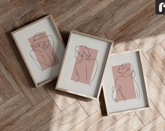 May include: Three framed line drawings of women with a pink background. The drawings are in a minimalist style and feature the women's profiles.