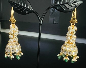 Jadau kundan earrings with rice pearls and green beads