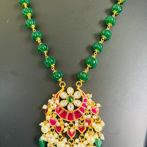 Jadau kundan pendant with green pumpkin beads chain