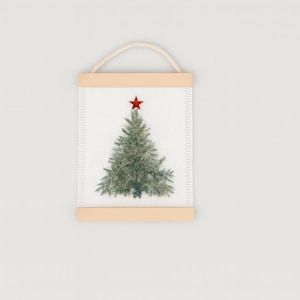May include: A rectangular Christmas tree wall hanging with a light beige wooden frame and a natural rope loop for hanging. The image features a green tree with a red star on top, set against a white background.