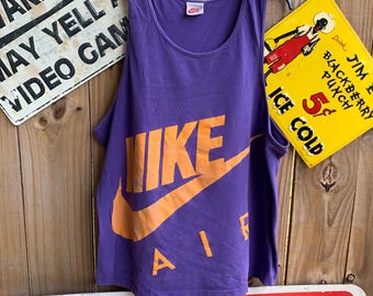 purple and orange nike shirt