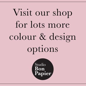 May include: A pink background with the text "Visit our shop for lots more colour & design options." A black circle with the text "Studio Bon Papier" is at the bottom.