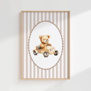 May include: A framed print with a watercolour illustration of a teddy bear in a vintage car. The bear is light brown, and the car is beige. The background has a striped pattern in beige and white.