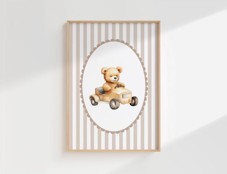 May include: A framed print with a watercolour illustration of a teddy bear in a vintage car. The bear is light brown, and the car is beige. The background has a striped pattern in beige and white.