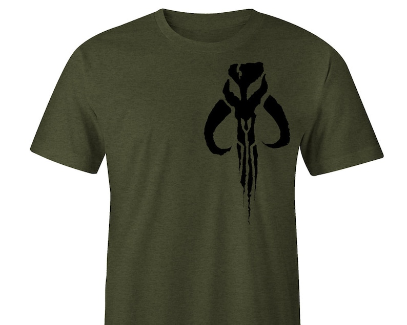 May include: A green t-shirt with a black Mandalorian symbol printed on the front.