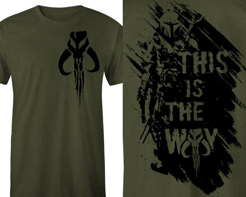May include: A green t-shirt with a black Mandalorian symbol on the left side and a black graphic on the right side that says "This is the Way" with a Mandalorian symbol at the bottom.