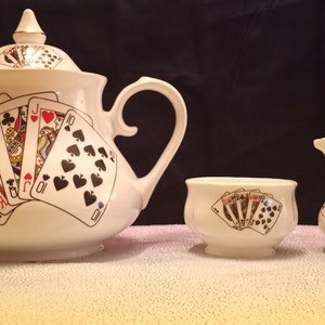 Vintage Royal Stuart teapot and creamer sugar set with playing cards.
