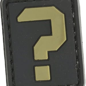 May include: A black and gold question mark patch with a stitched border. The patch is made of a rubber-like material.