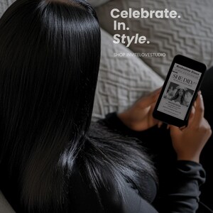 May include: A person holding a black and white digital tablet with the text "Graduation Issue" and "She Did It!" on the screen. The text "Celebrate. In. Style." is visible in the background.