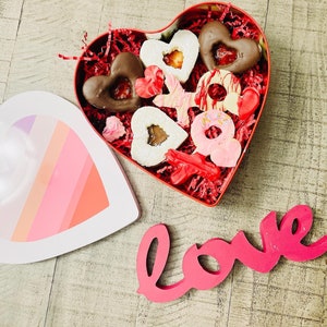 Box of Butter Cookies filled with strawberry jam and Nutella with heart shapes and XOXO