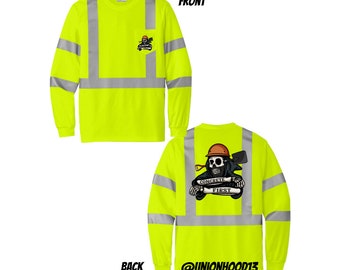 May include: A bright yellow long-sleeve shirt with reflective silver stripes. The shirt has a pocket on the front with a skull and crossbones graphic and the text "Concrete First" on the back. The shirt has the text "@unionhood13" on the back.