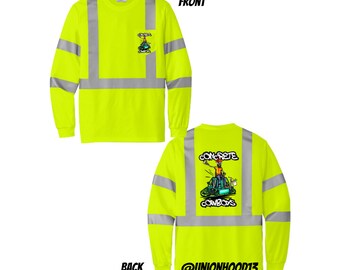 May include: A neon yellow long-sleeve shirt with reflective silver stripes. The shirt has a graphic on the back that says "Concrete Cowboys" with a cartoon image of a construction worker. The text "@UNIONHOOD13" is also on the back of the shirt.