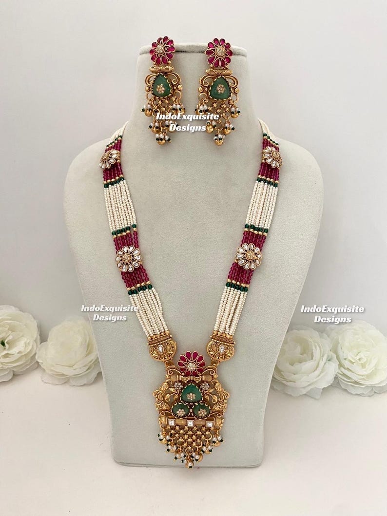 Sukkhi Premium Rakhi Combo Set For Brother - 2 Gold Plated Kundan & Pearl Rakhis With Meenakari, Roli Chawal & Greeting Card (CBRAK106943) - View #2