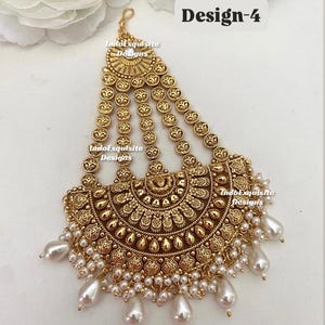 May include: Gold-toned headpiece with intricate embossed detailing and dangling faux pearls. The design features a half-moon shape with multiple strands of circular accents. The text "Design-4" is visible.