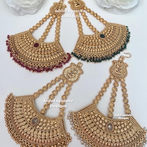May include: Four gold-toned fan-shaped earrings with intricate embossed patterns, featuring three beaded chains connecting to a top ornament. The earrings are accented with maroon, green, clear, and white beads. Text reads IndoExquisite Designs.