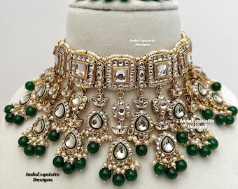 May include: A gold and white choker necklace with green beads and a matching bracelet. The necklace has a square design with clear stones and the text "IndoExquisite Designs" is visible on the image.