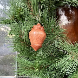 Elegant vintage wooden finial ornament. Hand turned in Texas. Looks great hanging from a tree or door handle. Sure to make you smile.