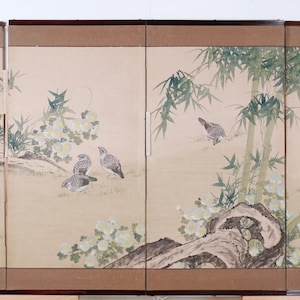 May include: A multi-panel artwork featuring birds in a natural setting. The artwork depicts several birds perched on branches and flying among bamboo and flowering plants. The color palette includes shades of brown, green, and white.