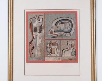 May include: Abstract artwork in a gold frame. The print features a series of geometric shapes and figures in shades of gray, red, and brown. The artwork is divided into several rectangular sections, creating a collage-like composition.