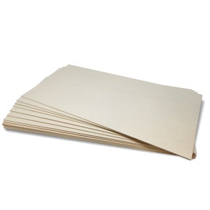 May include: A stack of 10 beige craft paper sheets.