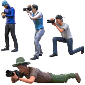 May include: A collection of miniature figurines depicting photographers in various poses. One figure kneels, another lies prone, and others stand, all holding cameras. The figures wear casual clothing in shades of blue, gray, and green.