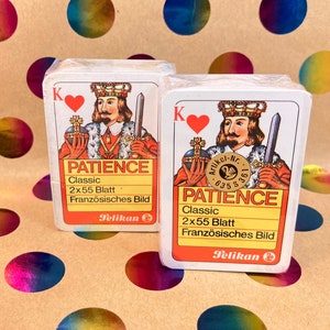 Cartas de baralho raras PATIENCE PELIKAN - Por volta de 1984 - 2 baralhos em celofane - “Franzosische BILD” - em pasta vermelha com zíper - incluindo livreto