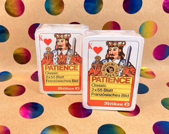 Rare PATIENCE PELIKAN playing cards - From approx. 1984 - 2 decks in cellophane - “Franzosische BILD” - in red zippered folder - incl. booklet