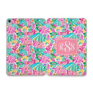 May include: A pink and white floral patterned phone case with a pink monogram "RSS" in a white frame.