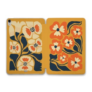 May include: A mustard yellow iPad case with a floral pattern. The flowers are orange, red, and white with dark blue leaves.