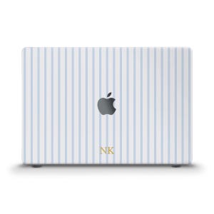 May include: A laptop skin featuring a pattern of vertical light blue and white stripes. The center of the skin displays a dark gray Apple logo cutout, and the letters NK are printed in a gold serif font near the bottom edge of the laptop cover.