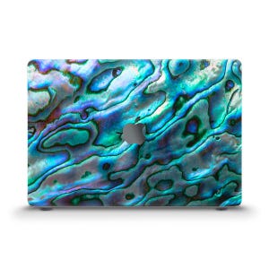 May include: A laptop skin with a blue, green, and purple iridescent abalone shell pattern.