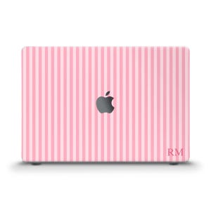 May include: A pink and white striped laptop cover with the Apple logo in the center. The cover has a vertical stripe pattern and the initials "RM" are in the bottom right corner.