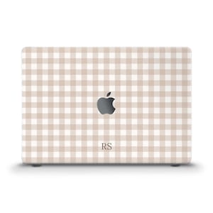 May include: A laptop skin featuring a beige and white gingham check pattern. The design includes a centered Apple logo cutout and the letters RS printed in a dark serif font below the logo, creating a personalized look for the device cover.