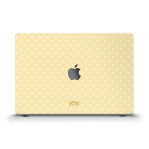 May include: A yellow laptop cover with a white polka dot pattern. The Apple logo is centered, with the initials "RW" below it. The cover is designed to fit a laptop.
