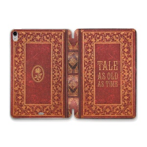 May include: A red leather iPad case with a gold design and the text "TALE AS OLD AS TIME".