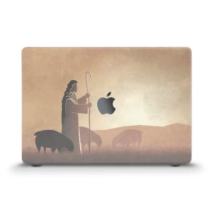 May include: A laptop skin with a beige background featuring a silhouette of a person with a staff, leading sheep. The Apple logo is visible in the top right corner.