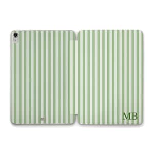 May include: A light green and white striped tablet case, open to display the interior. The case has a vertical stripe pattern. The initials "MB" are visible on the right side of the case.