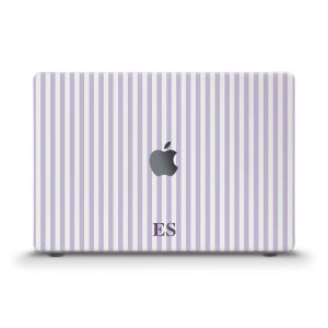 May include: A laptop skin featuring a pattern of vertical light purple and white stripes. The center of the skin displays a dark gray Apple logo and the capital letters ES printed in a dark gray serif font below the logo on the striped surface.