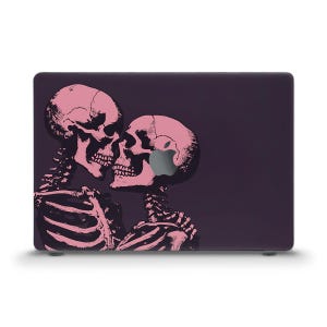 May include: A laptop skin with a graphic of two pink skeletons kissing on a dark purple background.