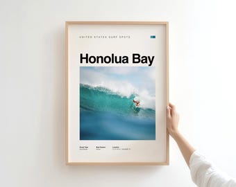 May include: Framed poster featuring a vibrant image of a surfer riding a large turquoise wave at Honolua Bay. The poster includes the text "Honolua Bay" in bold black letters, with additional text indicating the location and surf conditions.
