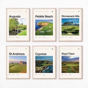 May include: Six framed prints of famous golf courses. The top row displays Augusta, Pebble Beach, and Shinnecock Hills. The bottom row shows St Andrews, Cypress, and Royal Troon. Each print has a photograph of the course with the course name in bold black text.