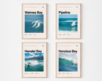 May include: Four framed posters featuring surf spots: Waimea Bay, Pipeline, Hanalei Bay, and Honolua Bay. Each poster has a photograph of a surfer riding a wave, with the location name in bold text above the image. The posters are in a light beige frame.