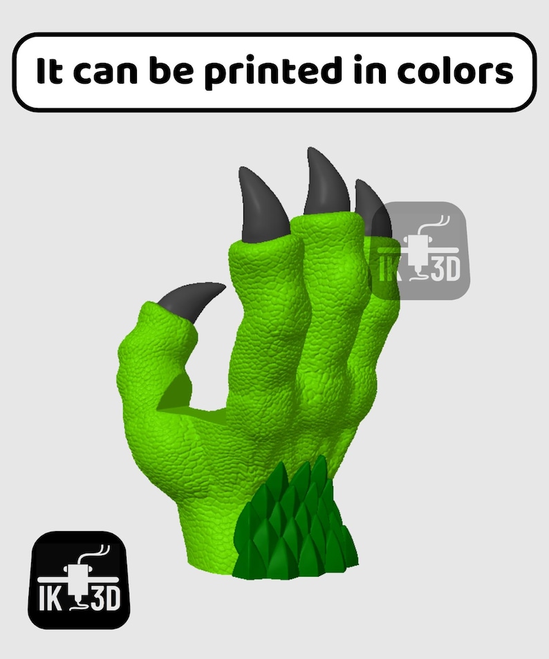 May include: A 3D printed green monster hand with black claws. The hand is posed with the fingers curled in. The text "It can be printed in colours" is at the top of the image.