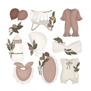 May include: A set of baby shower decorations featuring a crib, a bottle, a bib, a bonnet, a bow, and two outfits. The decorations are in shades of pink, brown, and white with floral accents.