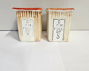 Vintage ceramic outhouse salt and pepper shakers