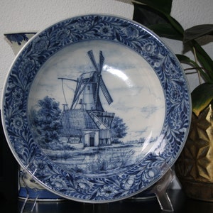 A large wonderful mill decor delftware wall plate by Royal Tichelaar Makkum