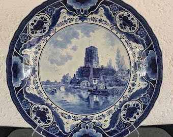 Rare large De Porceleyne Fles (Royal Delft) Delft blue 'Dutch village view from the water' charger (1928)