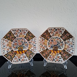 Pair of octagonal ribbed Royal Tichelaar Makkum Delft polychrome floral decor wall plates