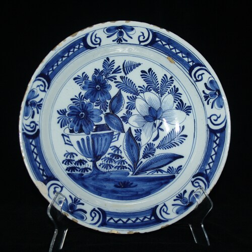 An antique 18th shops century Delft blue delftware plate - floral decor